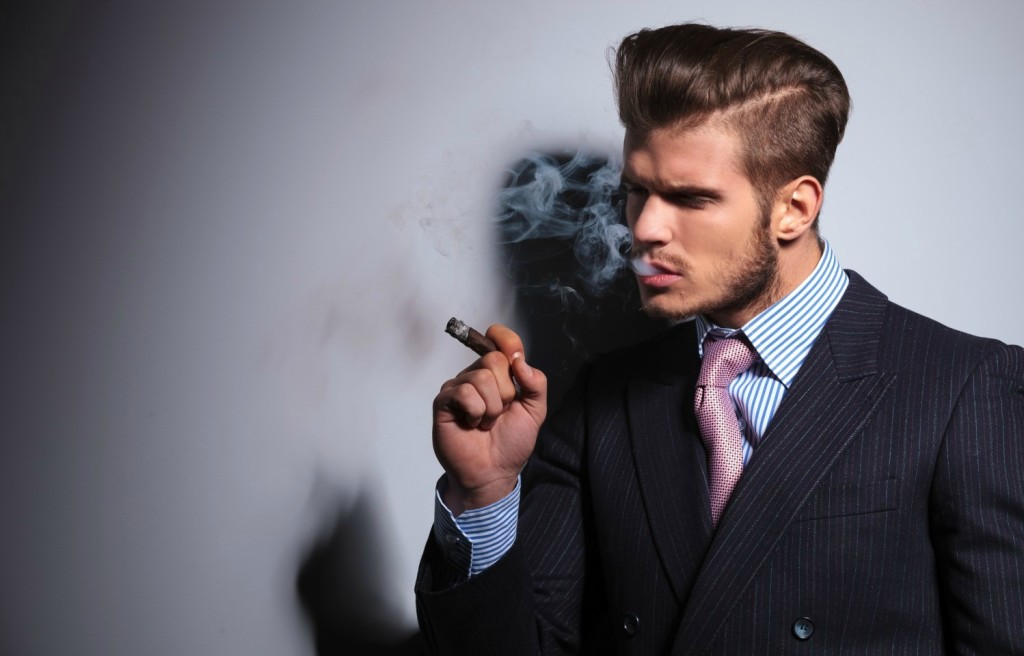 Fashion-model-in-suit-and-tie-enjoying-his-cigar-1024x656.jpg